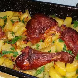 Картофи на фурна с пилешки бутчета